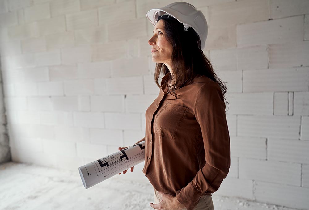 Architect looking at near-finished building