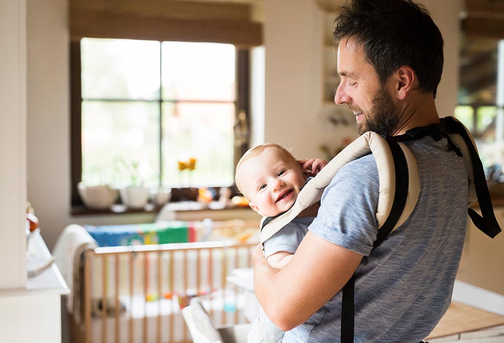 Young father with new baby